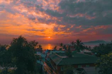 A vibrant sunset view over Langkawi's lush rainforest and coastline.