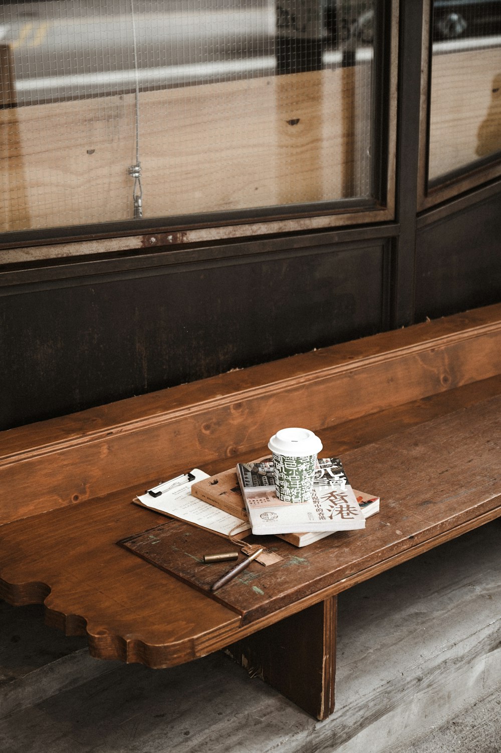 white newspaper on brown wooden table