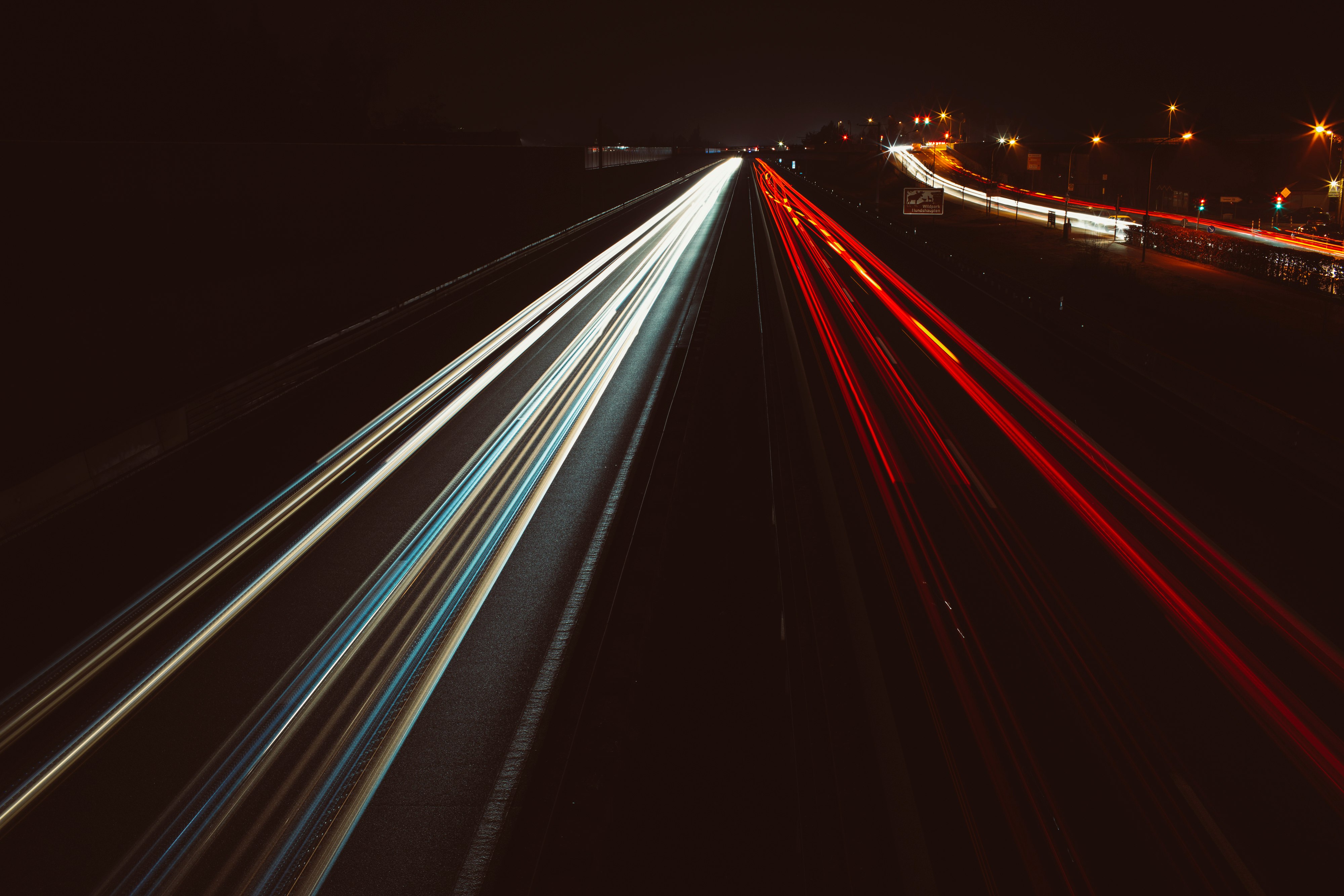 time lapse photography of cars on road during night time