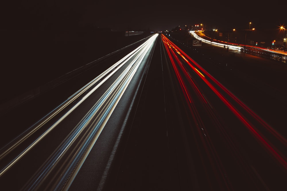 time lapse photography of cars on road during night time