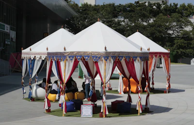 Volunteers setting up a welcoming space with colorful banners and comfortable seating.