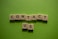 white and black dice on green textile