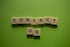 scrabble tiles spelling contact us