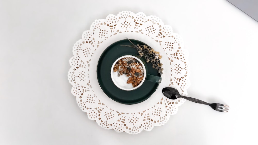 white and blue floral ceramic plate with soup