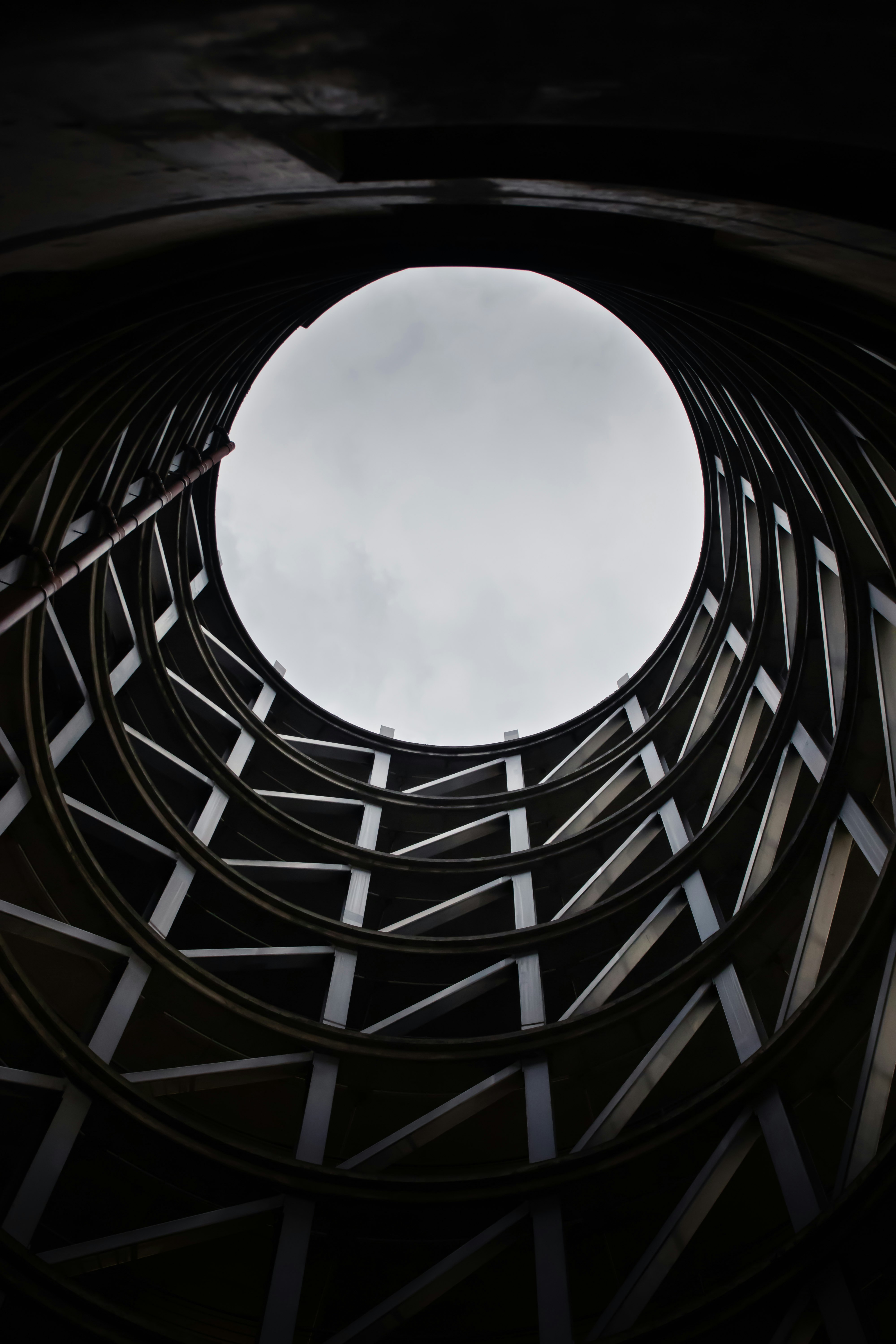 brown wooden frame under white clouds during daytime