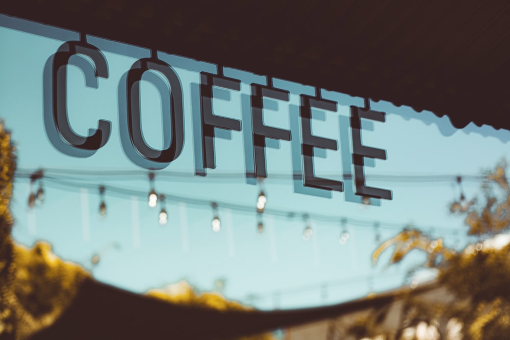 a close up of a sign that reads coffee