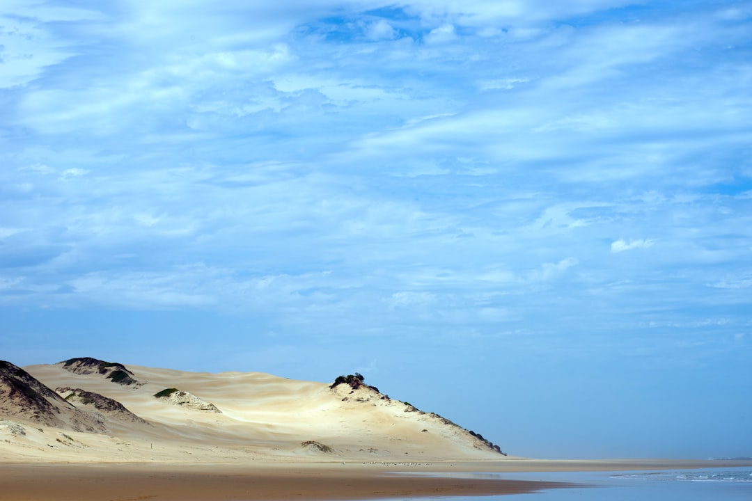 white sand under blue sky during daytime