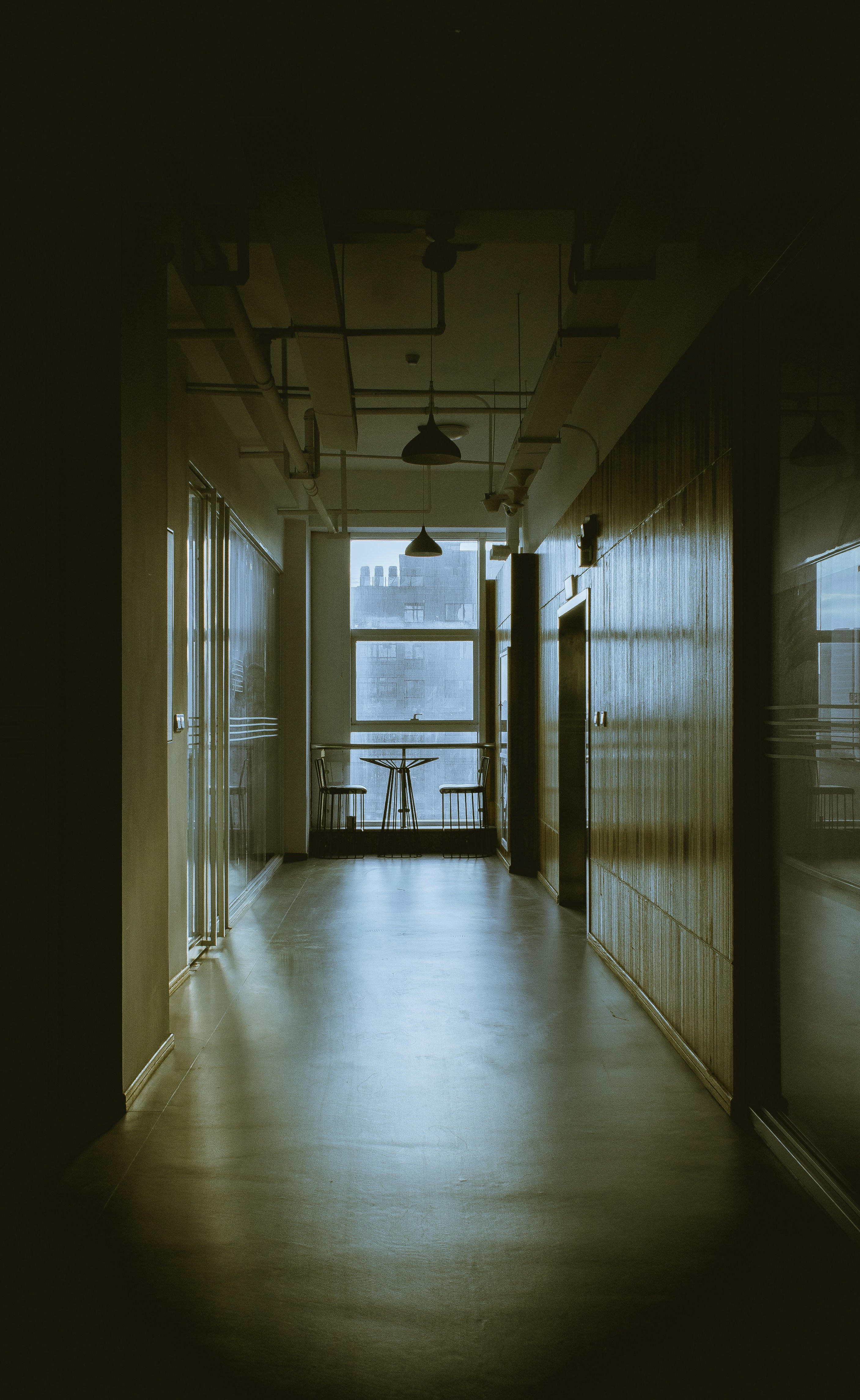 white and brown hallway with glass windows