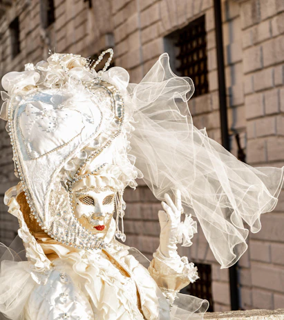 A classic Venetian masquerade mask adorned with gold and black patterns.