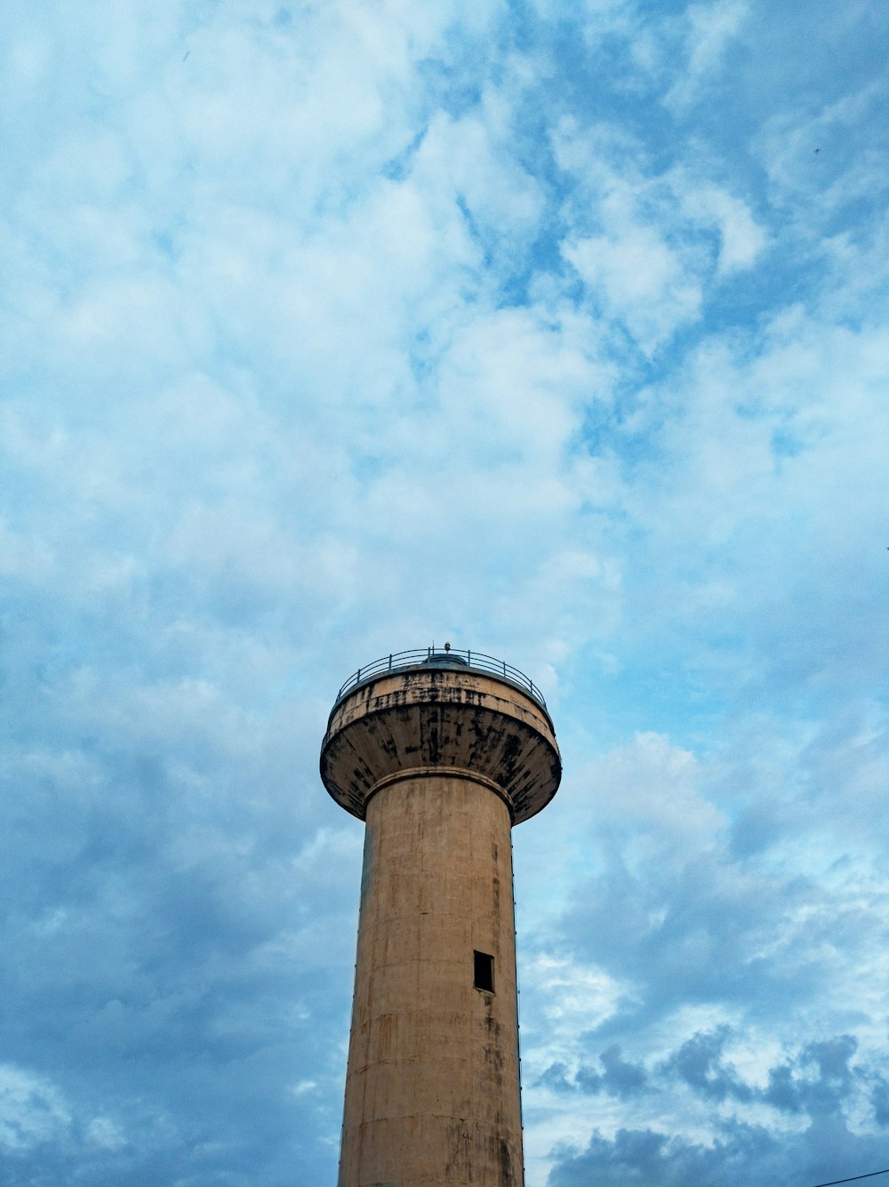 white and brown concrete tower under blue sky during daytime