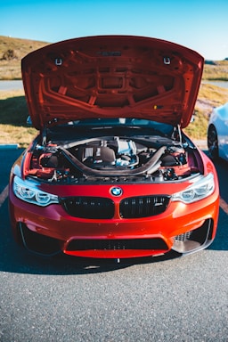 red bmw m 3 on road during daytime