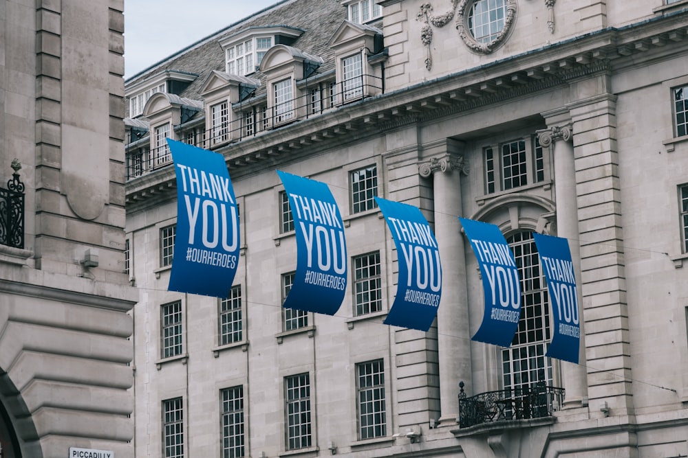 blue and white flag on building