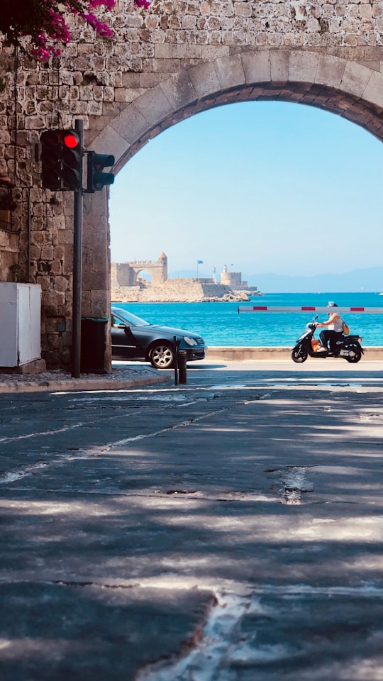 man in black jacket riding motorcycle during daytime in Rhodes Greece