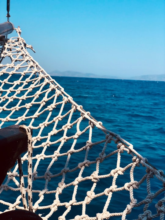 white and black rope on boat during daytime in Rhodes Greece