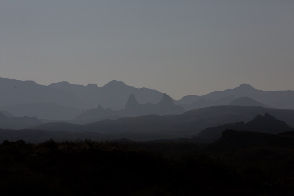 silhouette of mountains during foggy day