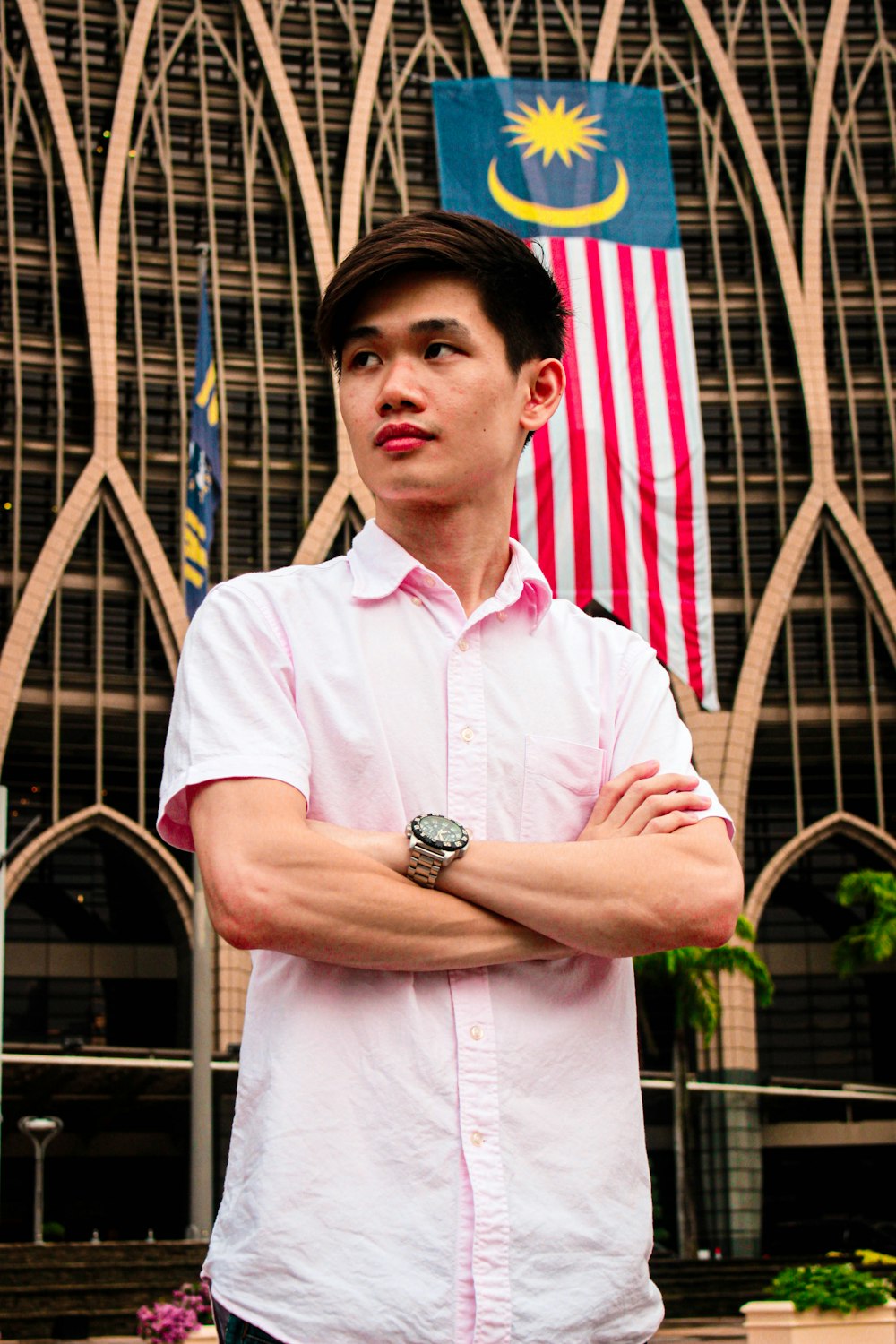 man in white button up shirt wearing gold round analog watch