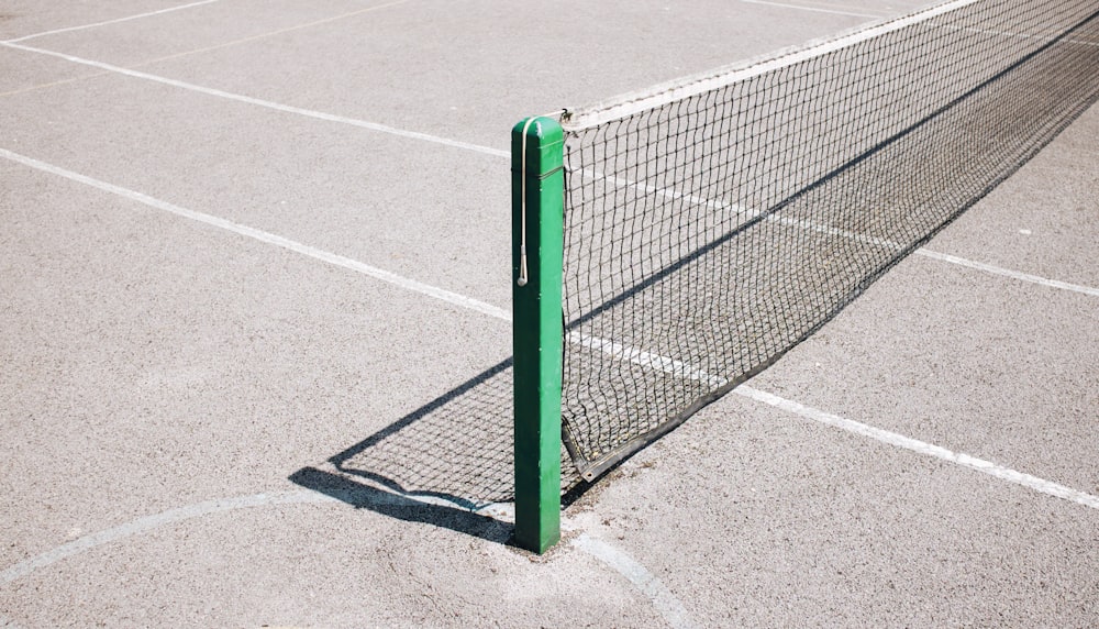 green and white metal fence