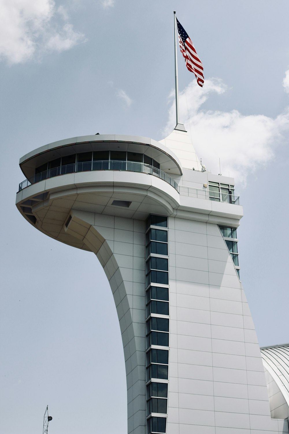 white concrete building with flag of us a on top