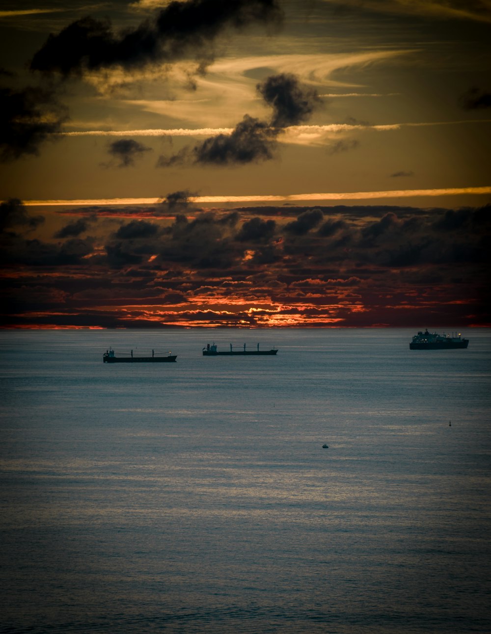 boat on sea during sunset