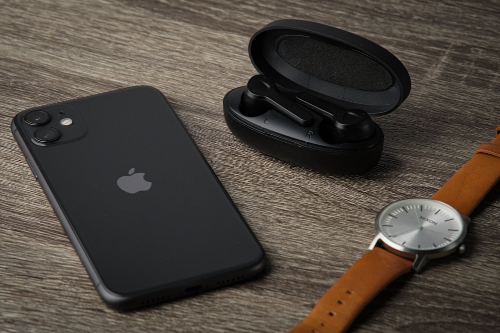 an apple watch and an iphone on a table