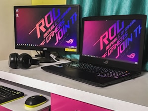 black laptop computer on white table