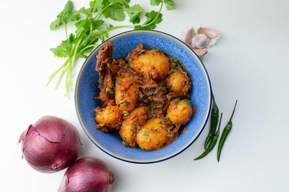 fried chicken on blue and white ceramic bowl