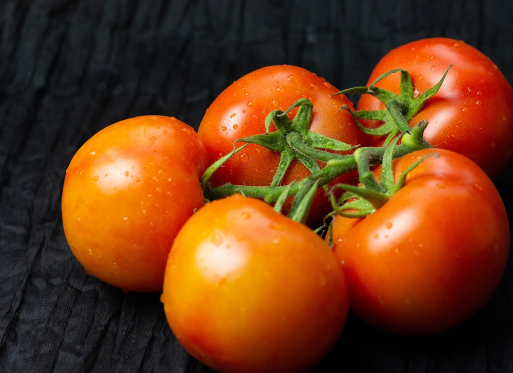 orange tomato on gray textile