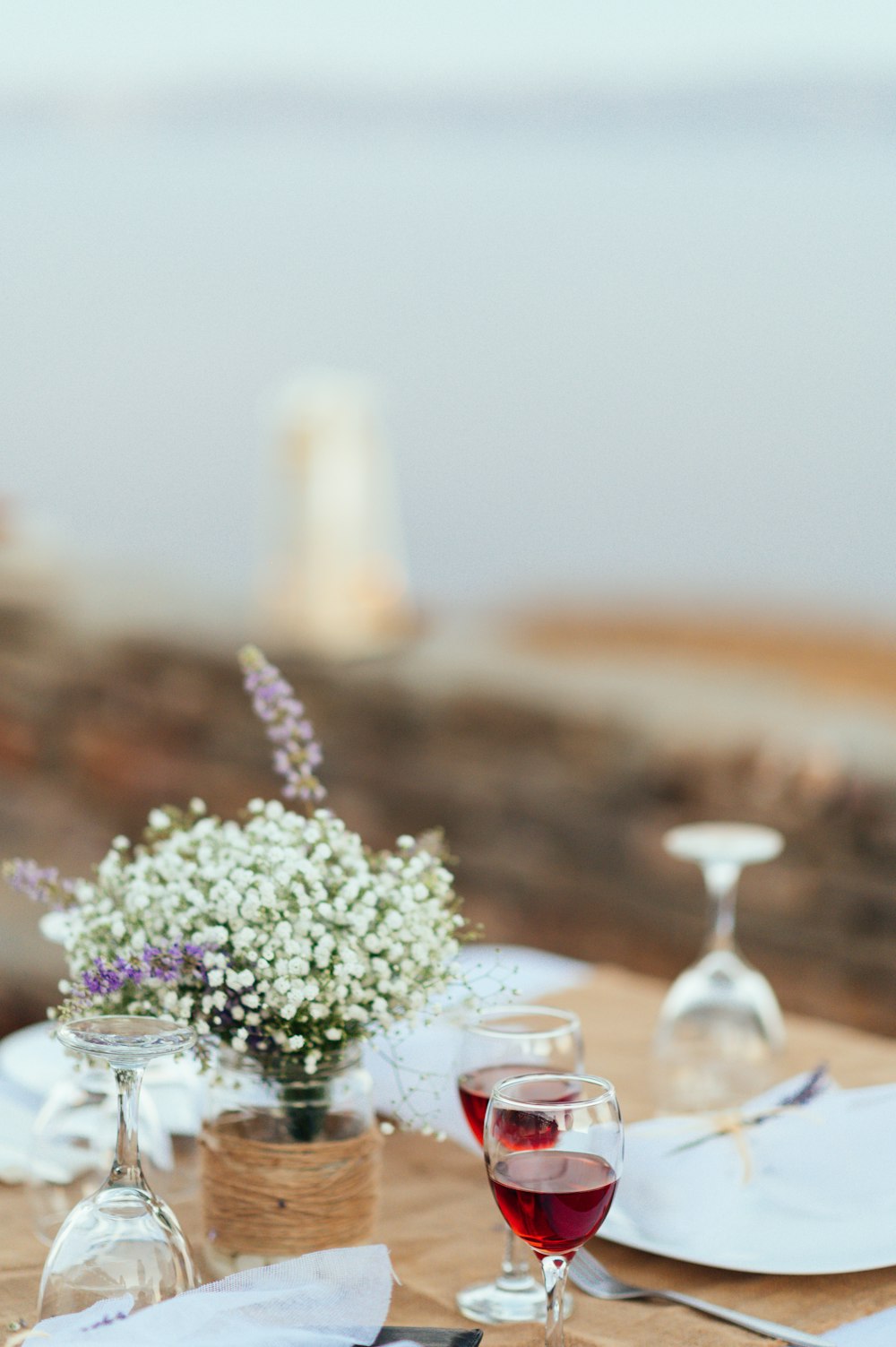 white flowers in clear glass vase on table