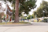 An institutional campus with students walking, symbolizing academic expansion.