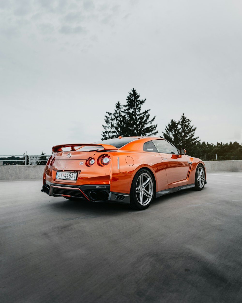 orange bmw m 3 on road