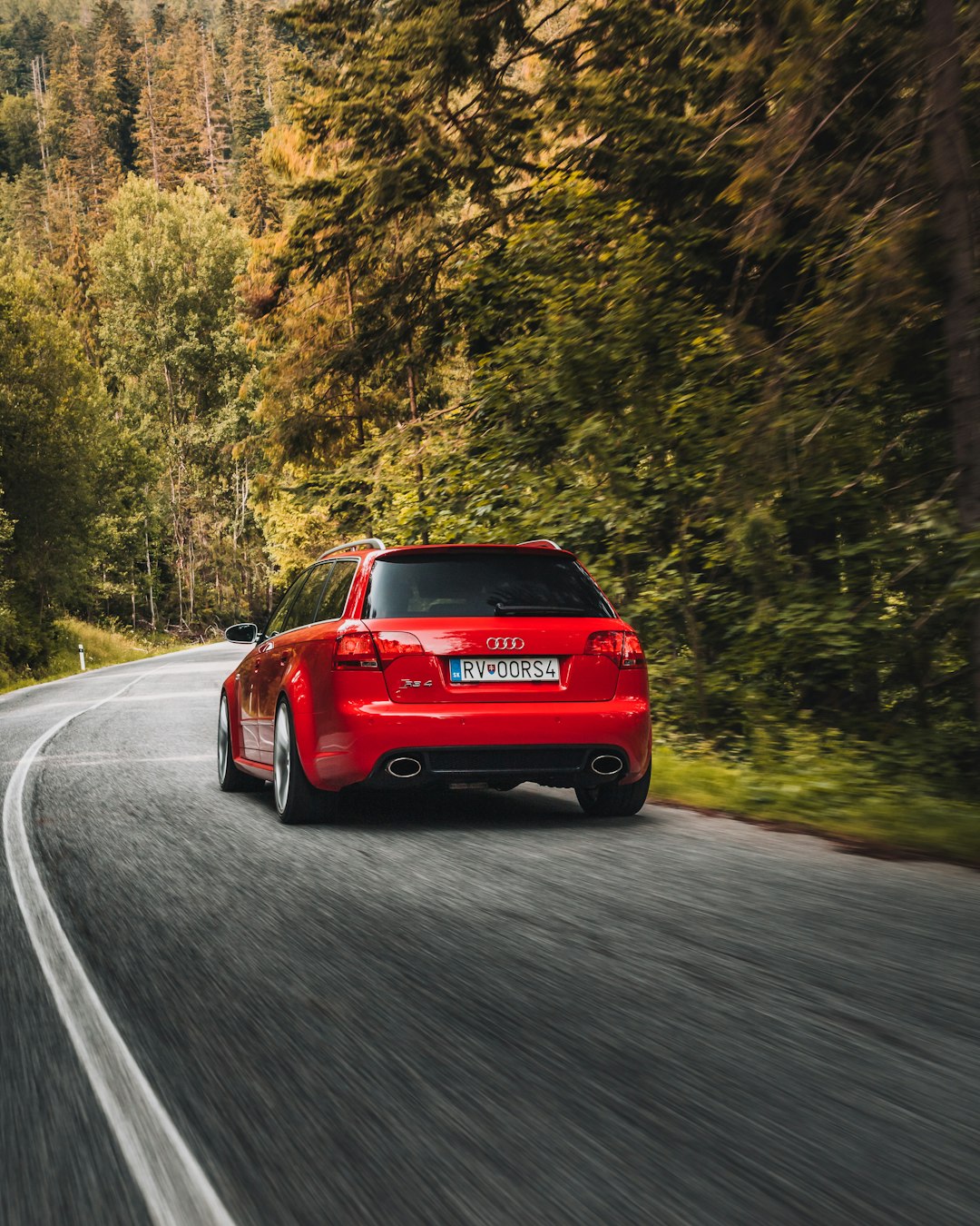 red car on road during daytime