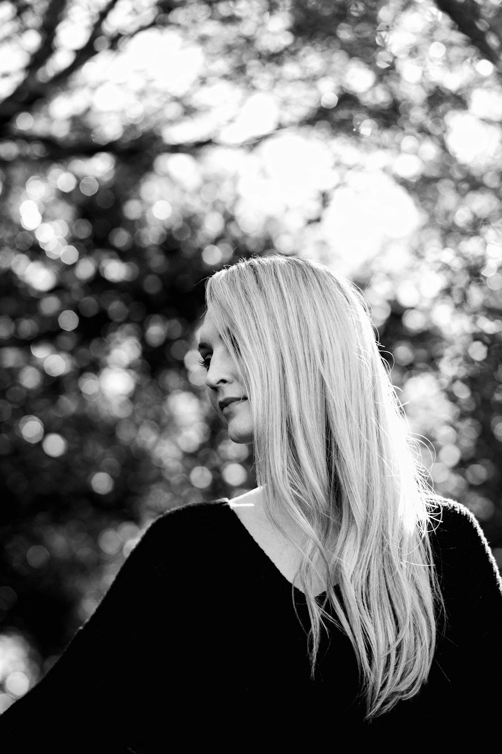 woman in black shirt in grayscale photography