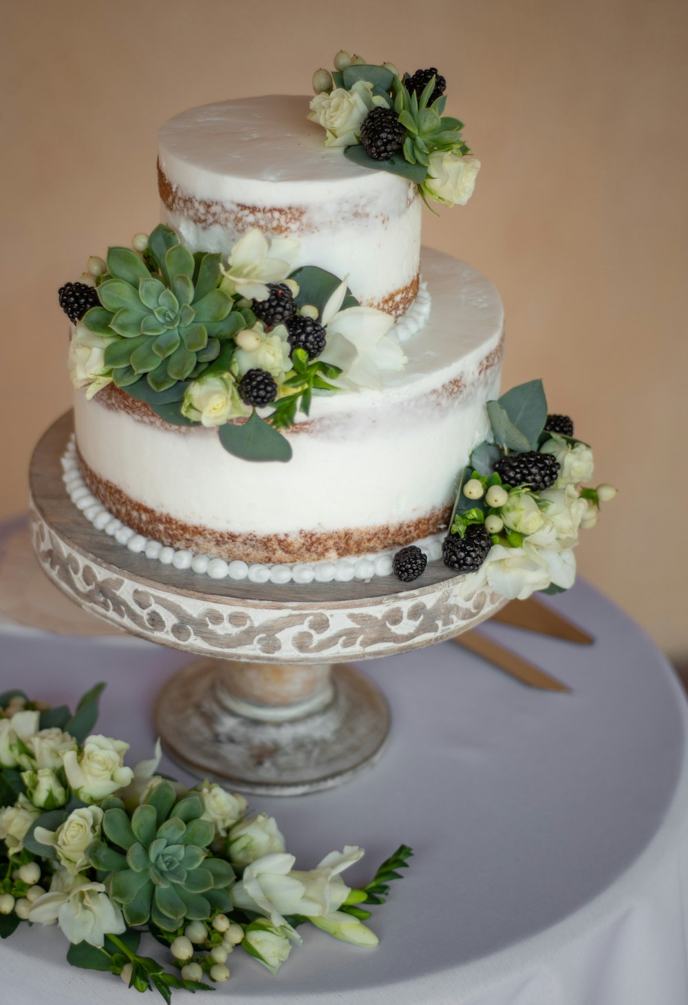 white and brown cake with green leaf on top