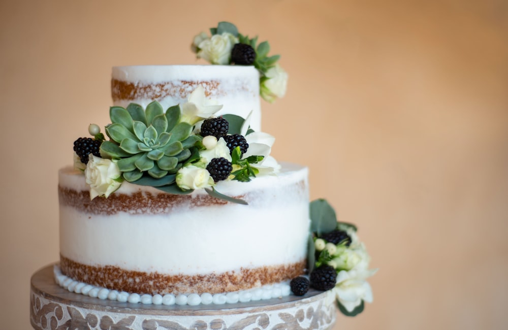 white and brown cake with green leaf on top