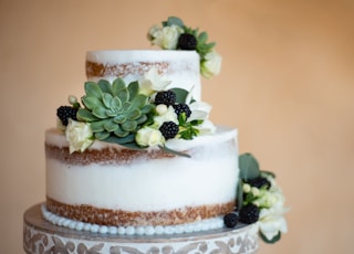 white and brown cake with green leaf on top
