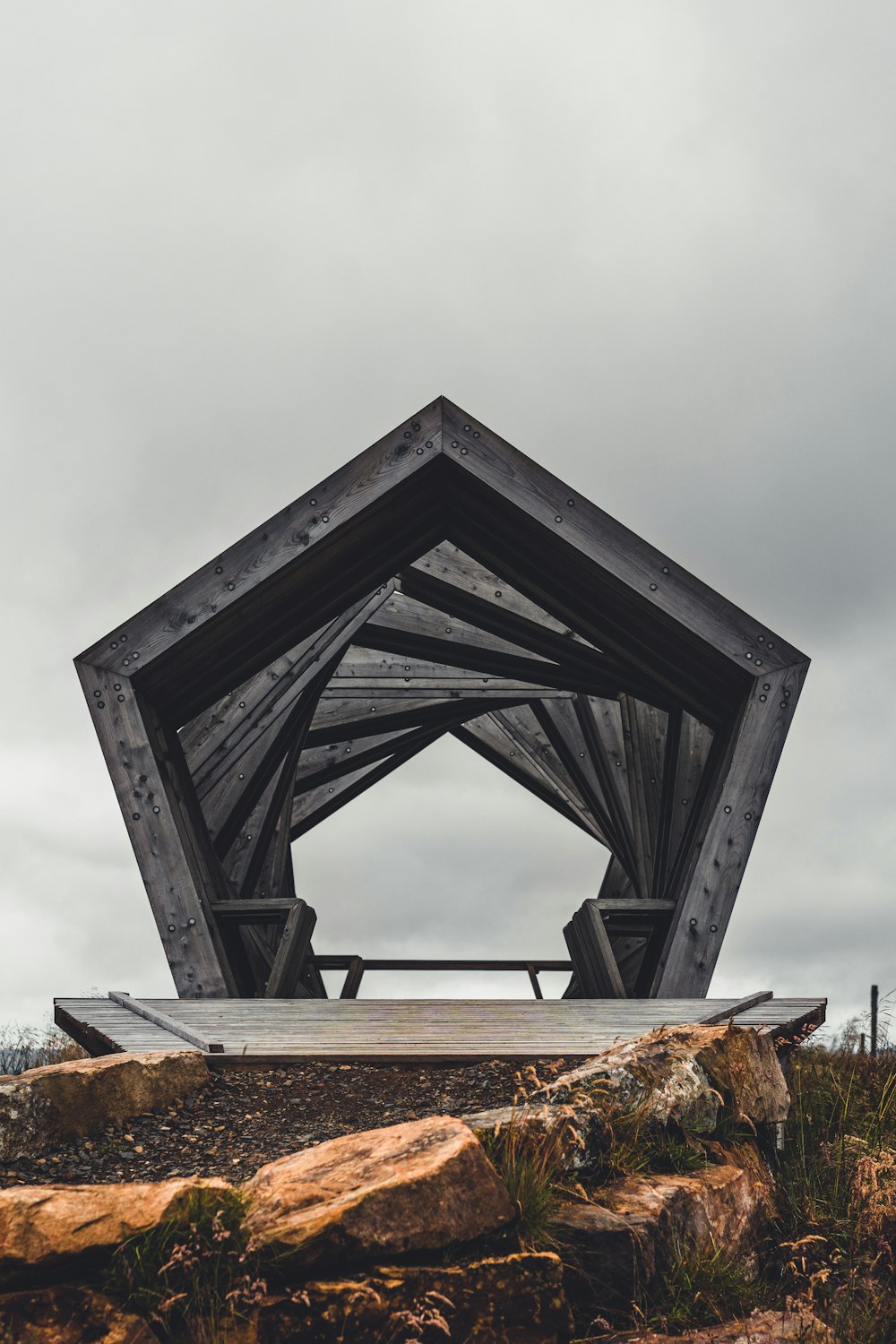 black wooden frame on brown rock