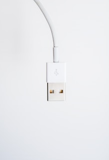 white usb cable on white surface