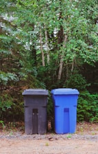 green and blue trash and recycling bins