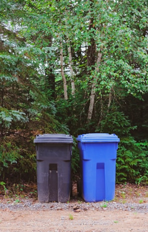 green and blue trash and recycling bins