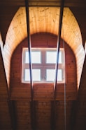 brown wooden framed glass window