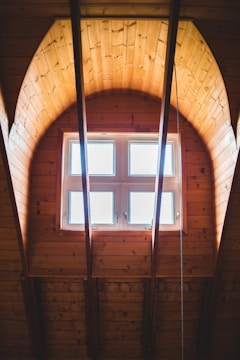 brown wooden framed glass window