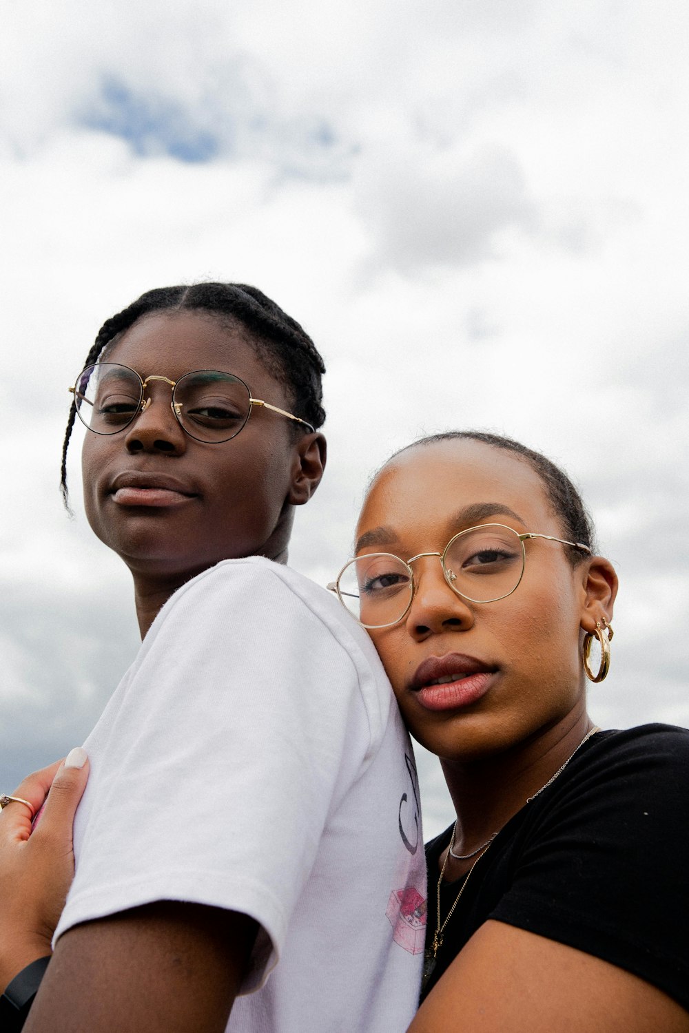 woman in black shirt beside woman in white shirt