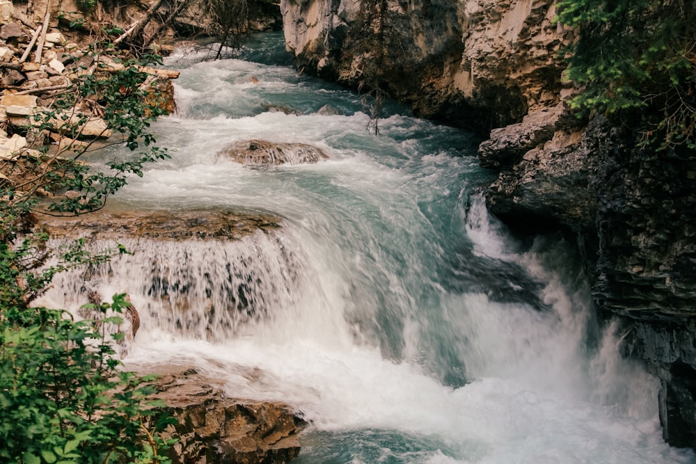 water falls on rocky mountain