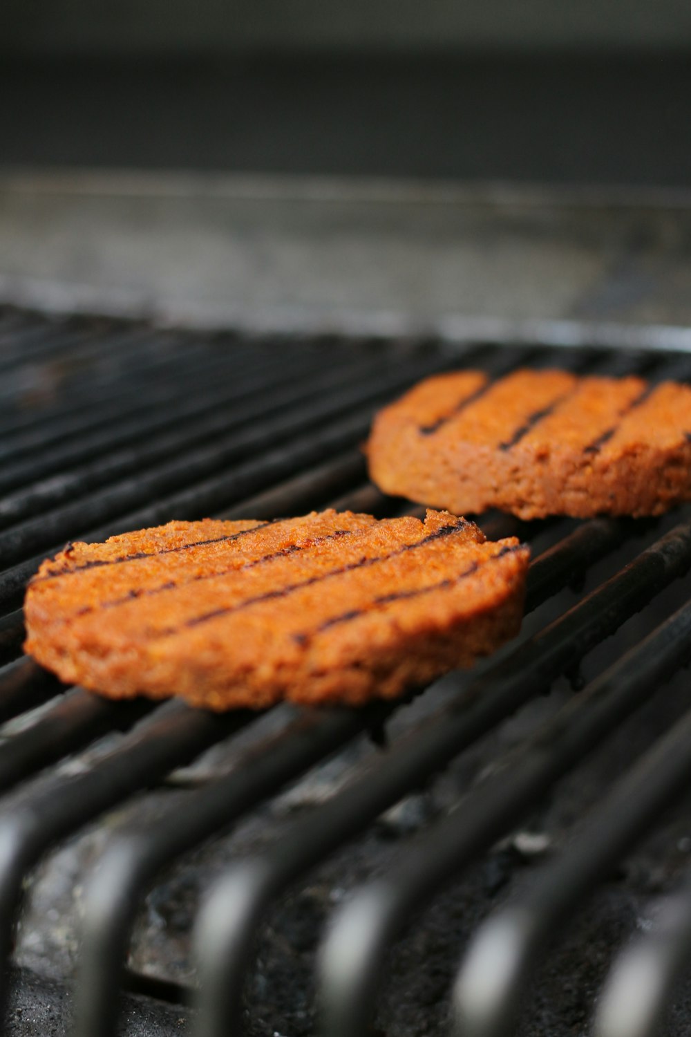 brown cookies on black metal grill