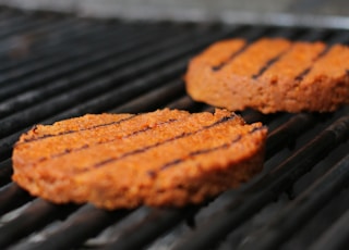 brown cookies on black metal grill