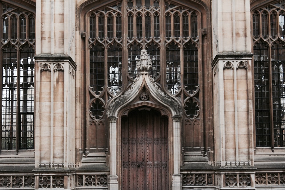 brown wooden door in brown concrete building