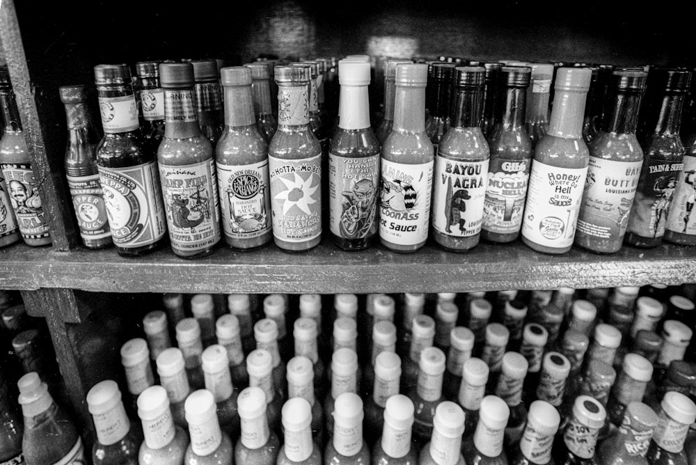 grayscale photo of spice supreme bottle