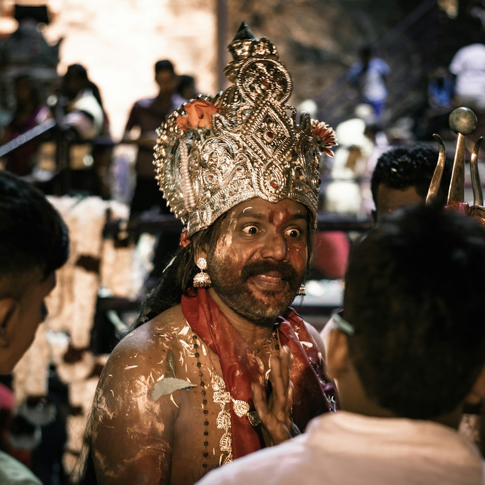 man in white and gold traditional dress