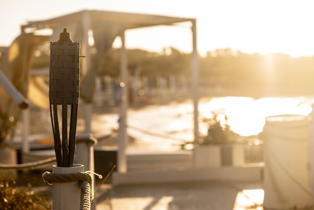 a close up of a pole with a boat in the background