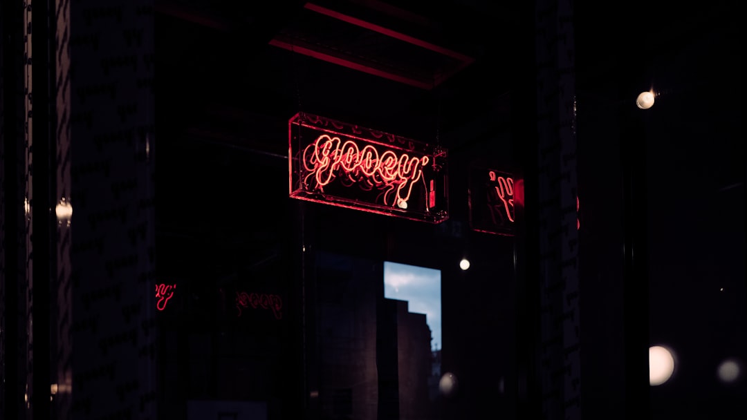 red and white UNKs neon light signage